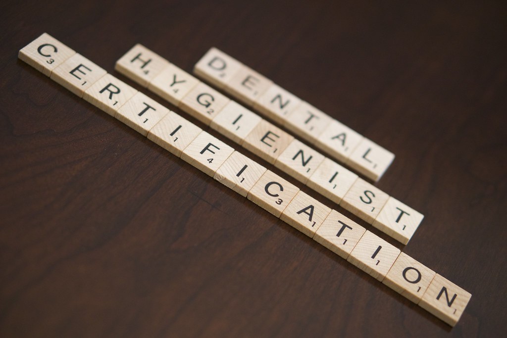 Dental hygienist performing professional cleaning procedure